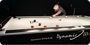 Person playing billiards