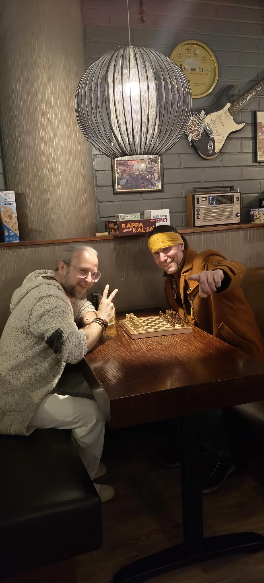 Members of RocknRollRebels playing chess